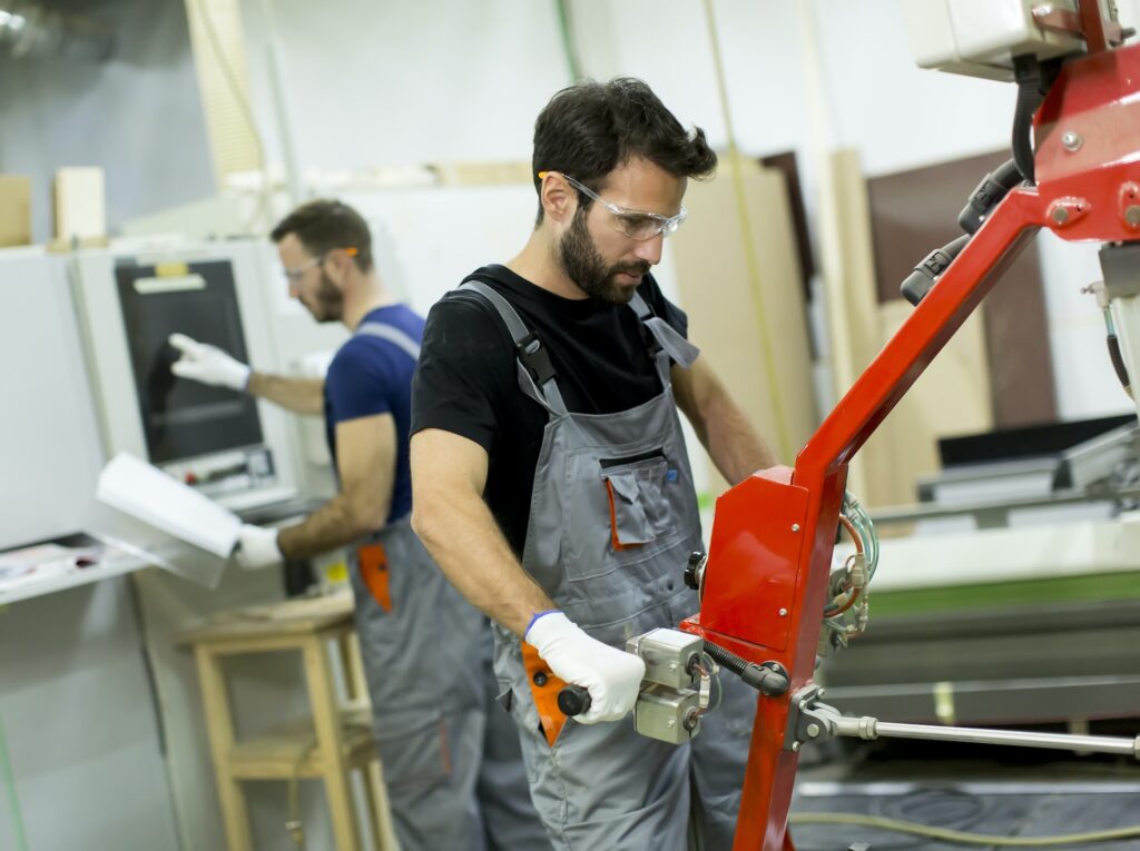 Young men working in factory